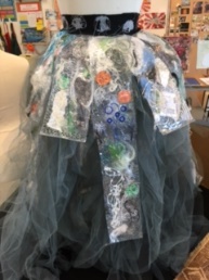 Dress made and adorned with recycled materials